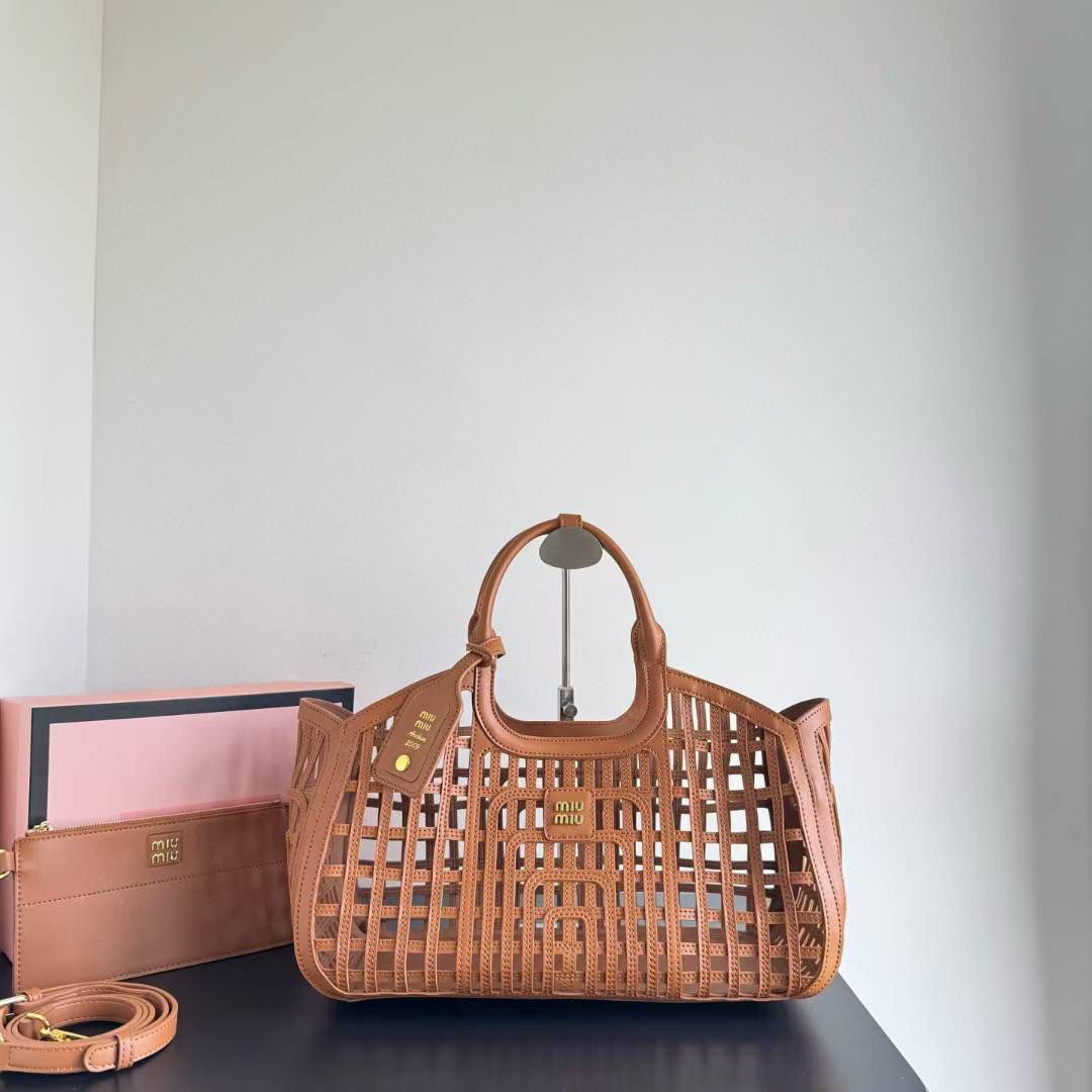 MIU MIU LEATHER TRIMMED LARGE BUCKET BAG WITH UTILITY POUCH
