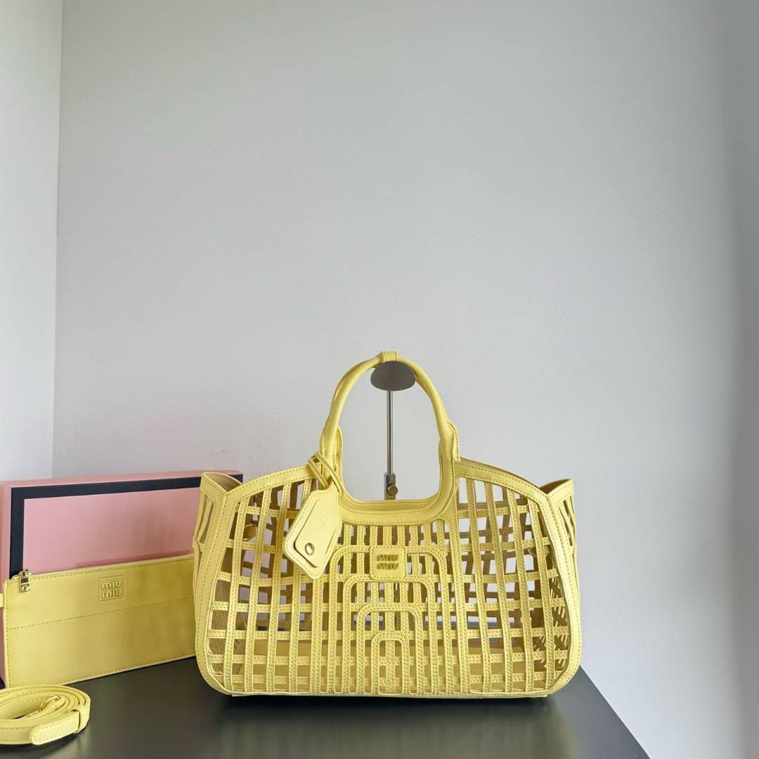 MIU MIU LEATHER TRIMMED LARGE BUCKET BAG WITH UTILITY POUCH