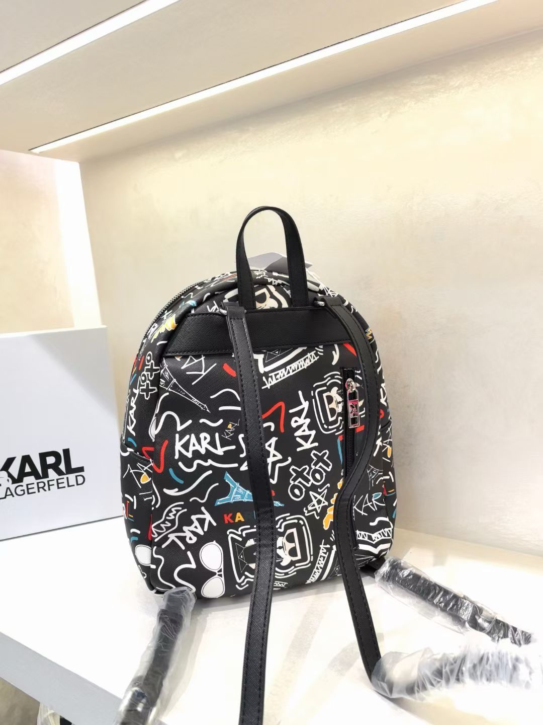 KARL PRINTED TASSLE BACKPACK