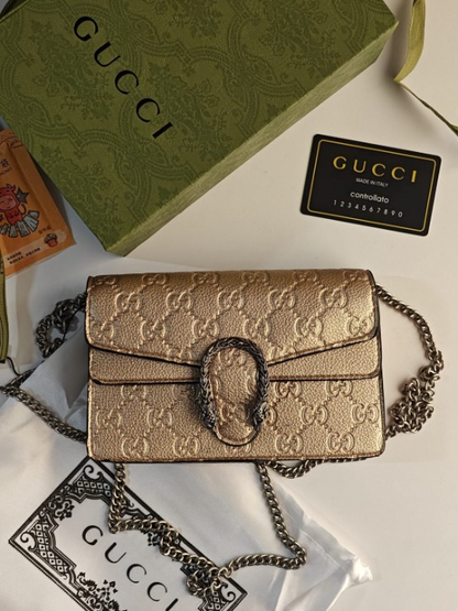 GUCCI GOLD EMBOSSED DIONYSUS