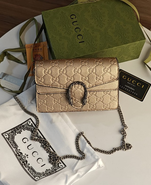 GUCCI GOLD EMBOSSED DIONYSUS