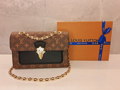 Louis Vuitton Victoire Monogram Handbag