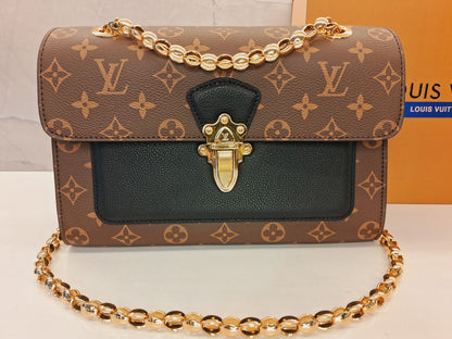 Louis Vuitton Victoire Monogram Handbag