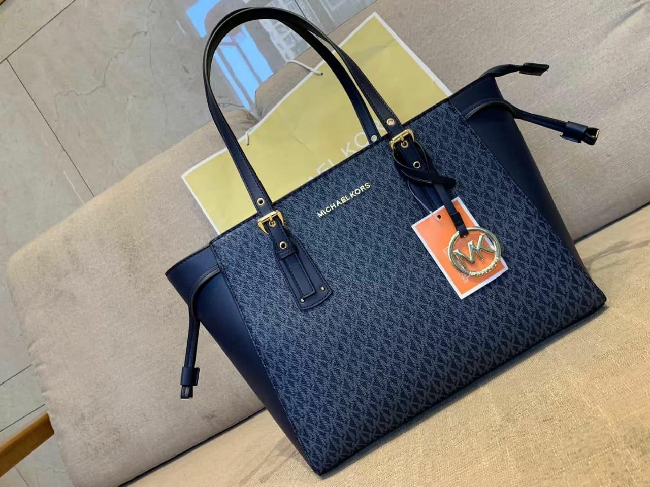 MICHAEL KORS VOYAGER TOTES