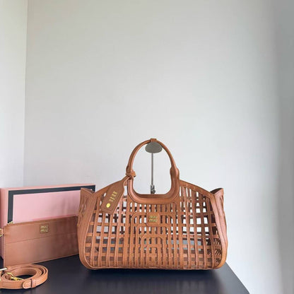 MIU MIU LEATHER TRIMMED LARGE BUCKET BAG WITH UTILITY POUCH