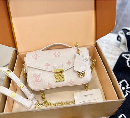 LOU-IS VU-IT-TON EAST WEST METIS POCHETTE