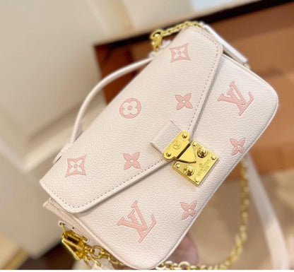 LOU-IS VU-IT-TON EAST WEST METIS POCHETTE